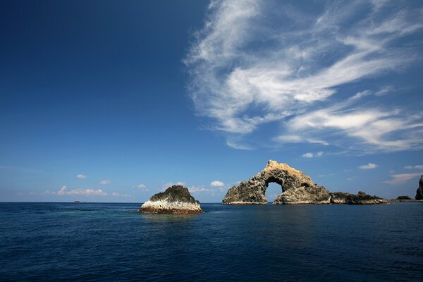 Dark sea, calm sea, rocks in the water