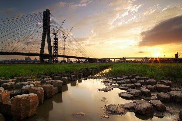 Bridge construction in the rays of the setting sun