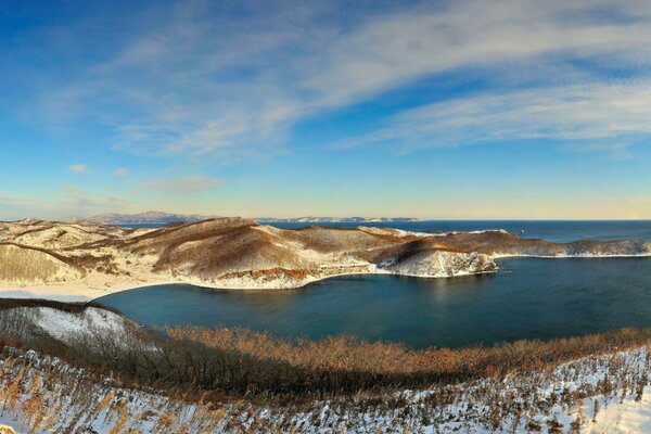 Panorama of the snowy seashore