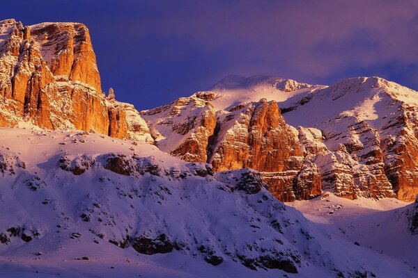 Mountains in snow against a blue sky