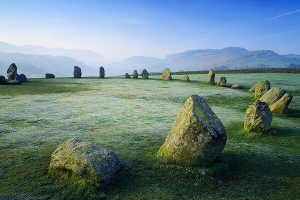 Beautiful stones in a clearing and behind them mountains