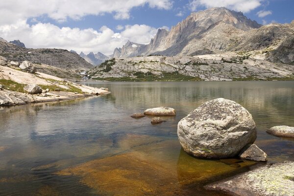 A river in the mountains. Stones on the water