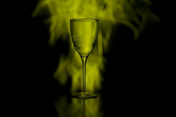 A glass of wine on a black background