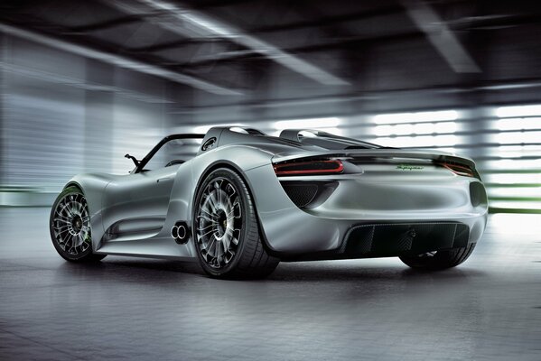 A beautiful concept of a silver Porsche. Rear view