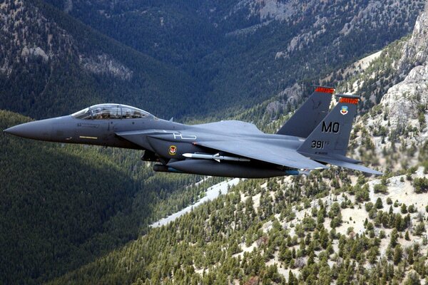 Fast fighter flying in the mountains