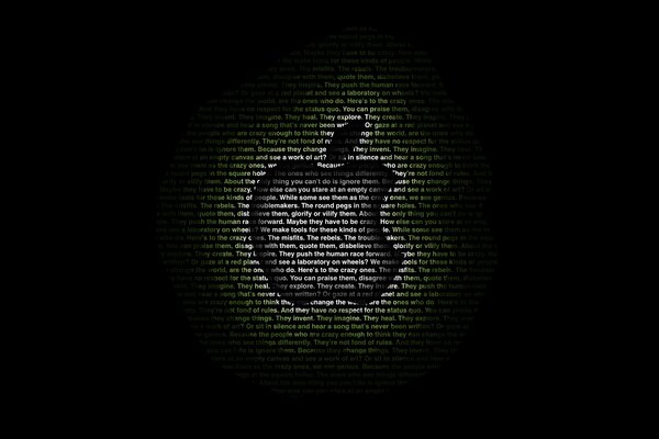 An apple with letters that turn into a black background