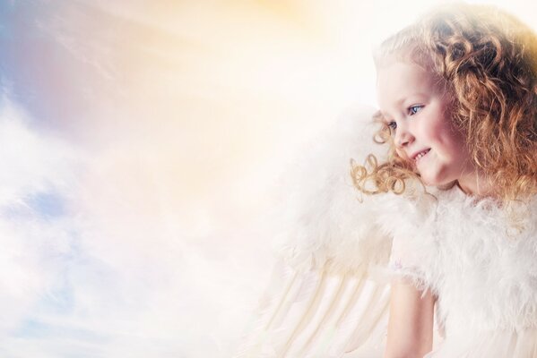 Angel girl on the sky background