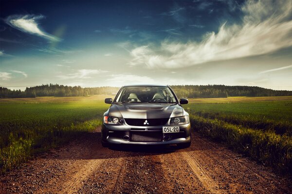 Charged silver Mitsubishi in the field