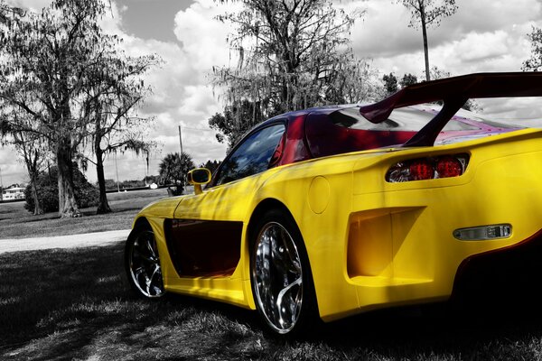 Yellow car on black and white background