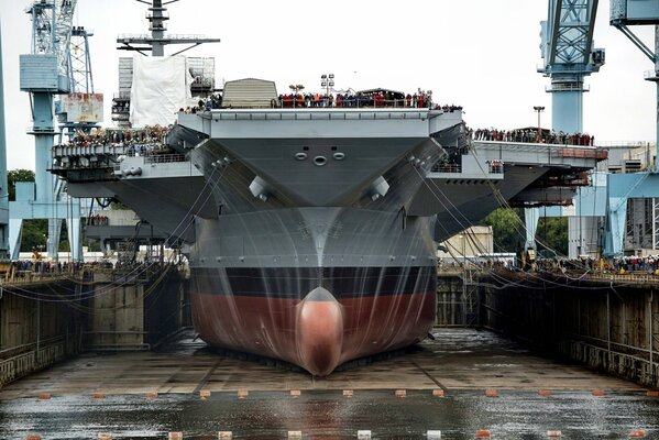 Aircraft carrier vessel with crew on deck