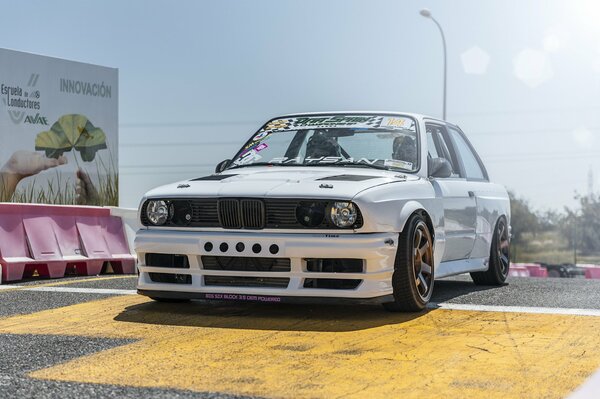 White BMW is getting ready to drift