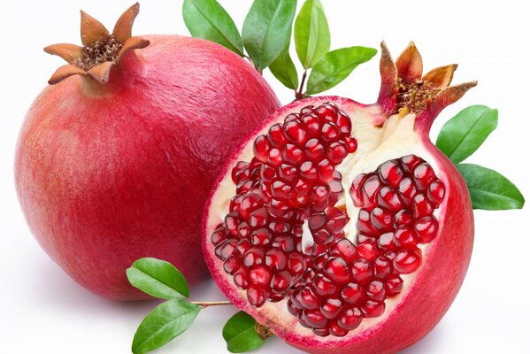 Red, ripe pomegranate on the table