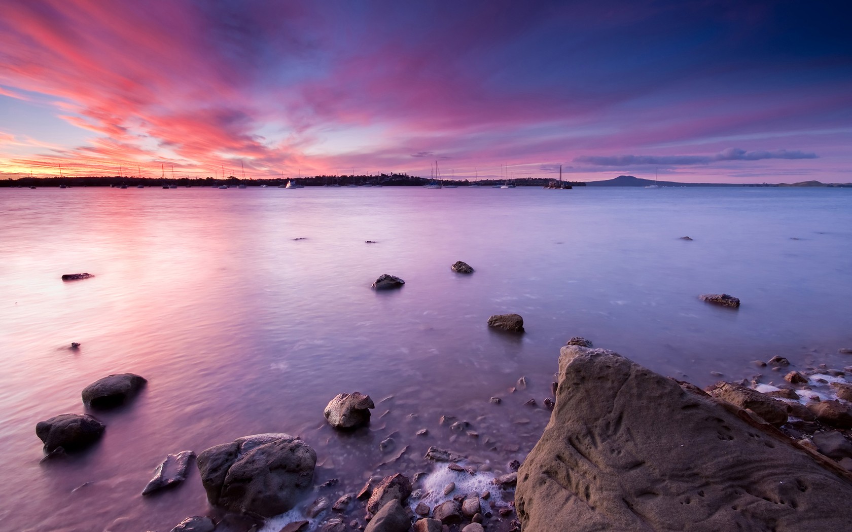 demi lune baie coucher de soleil auckland nouvelle-zélande