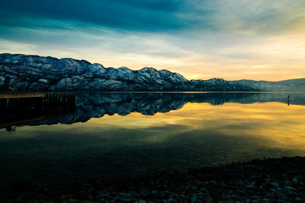 Sunset on the background of mountains and lakes