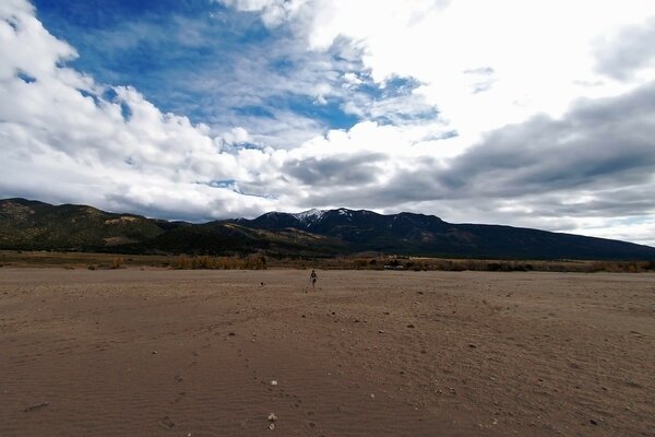 A trace of a man on the sand in the mountains