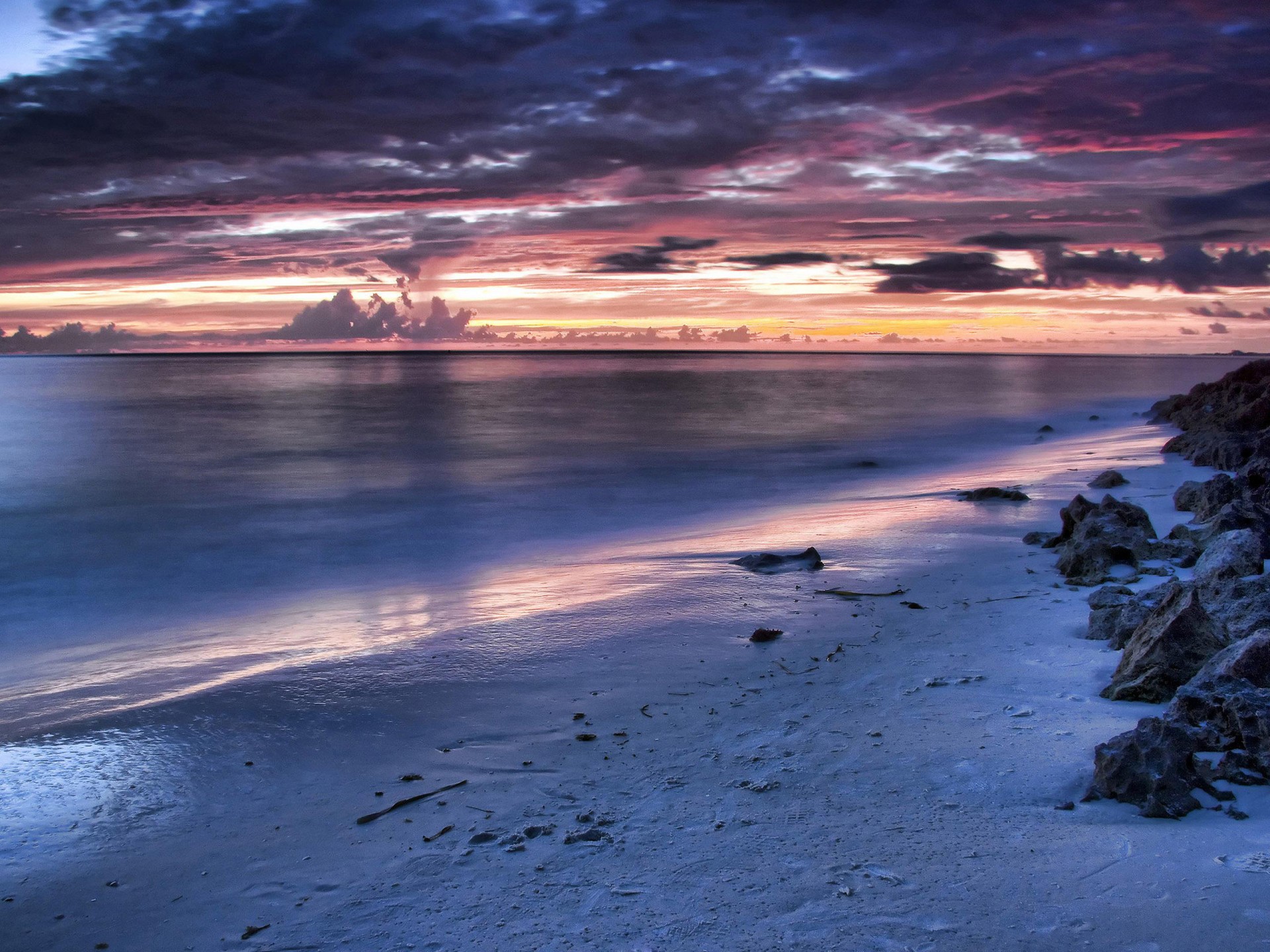 sera paesaggio mare cielo tramonto pietre sabbia spiaggia superficie liscia