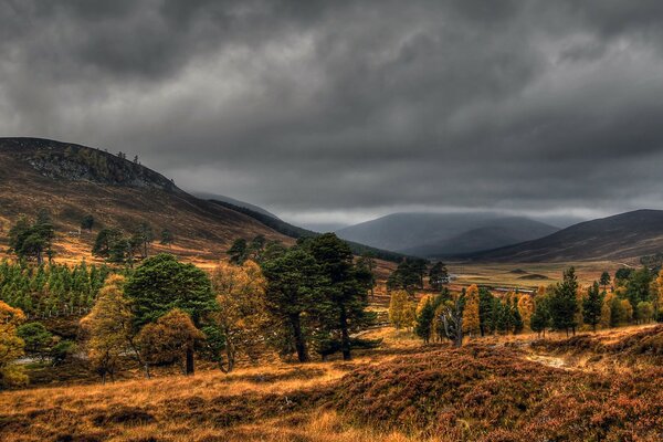 Gray clouds hovered over the mountains