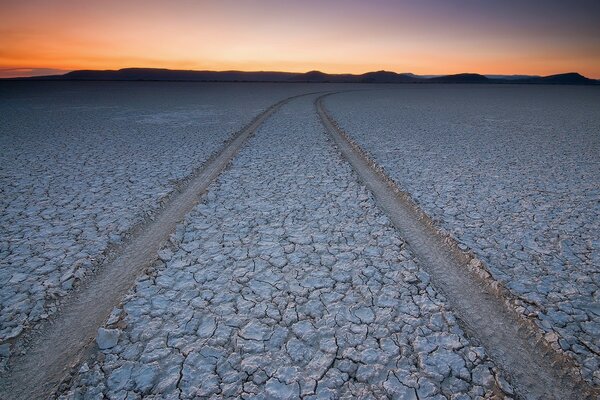 The road on the dried-up earth in cracks