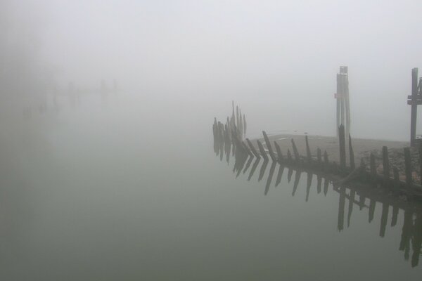 The remains of the ferry in the fog in summer