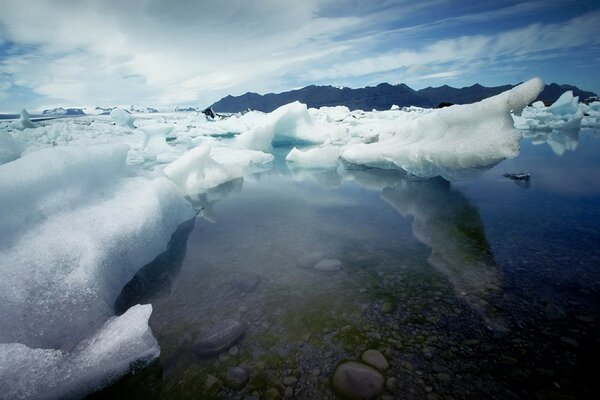 The surface of the water covered with ice