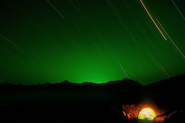 Green sky at night