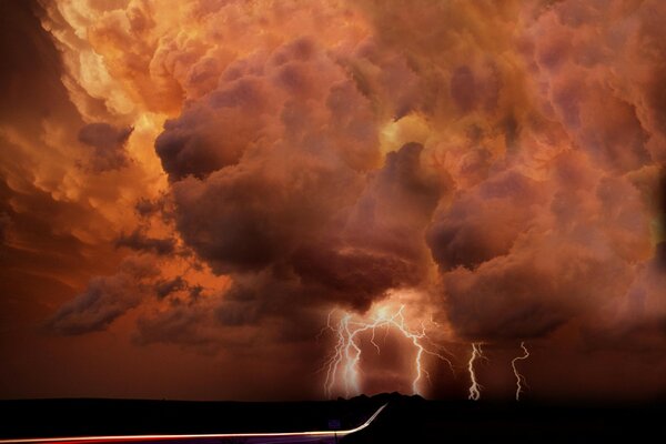 Crimson sky with clouds and lightning