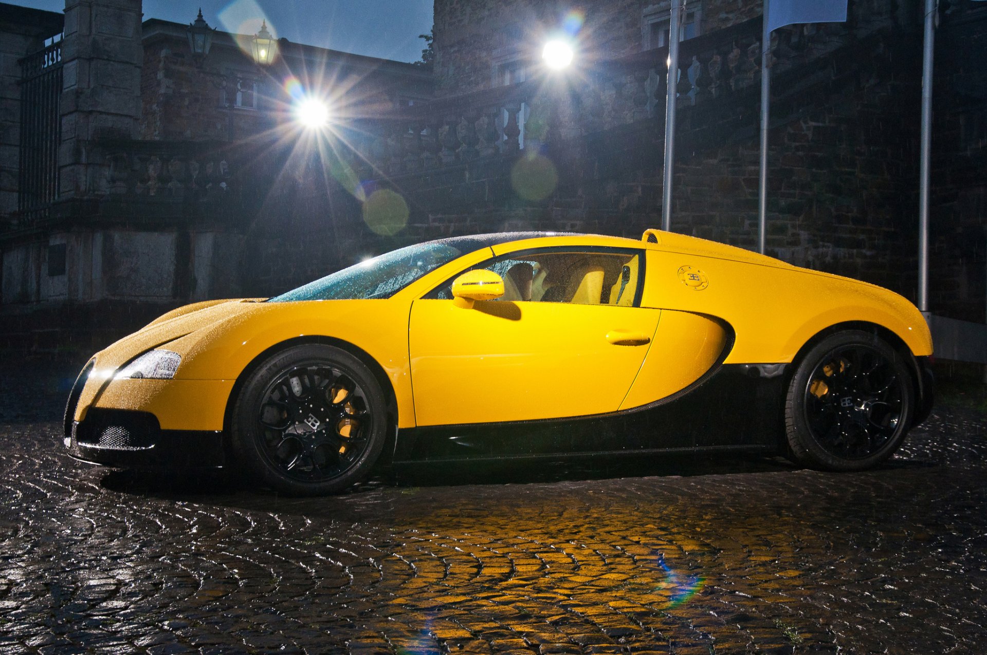 bugatti veyron grand sport middle east edition supercar yellow night rain drop light building