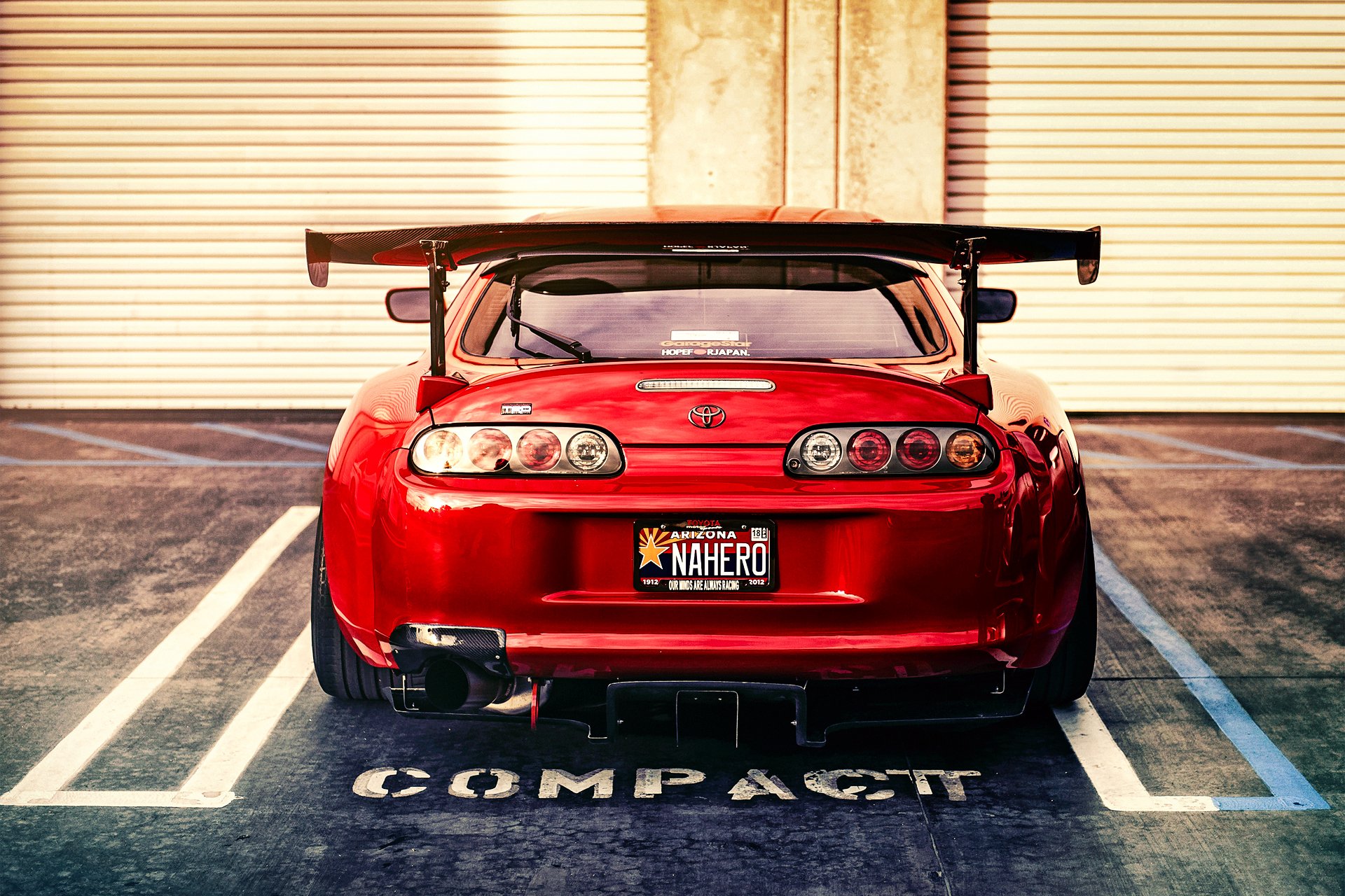 toyota supra red sports car rear view tuning