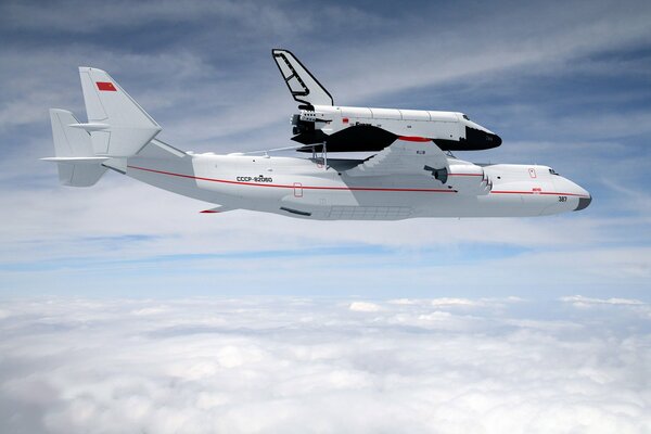 Against the background of a cloudy sky, the plane puts the Shuttle into orbit