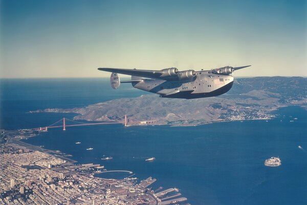 A big plane is flying over the city