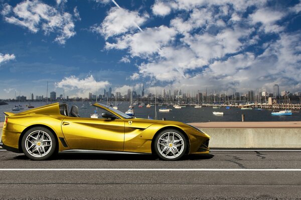 Golden convertible on the bridge in the city