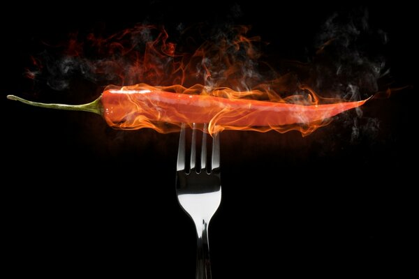 Burning hot pepper on a fork