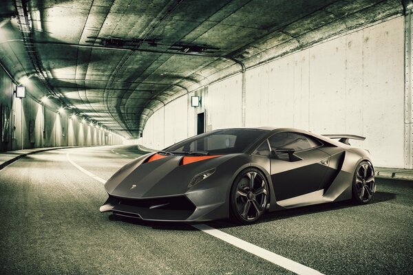 Black Lamborghini supercar in the tunnel