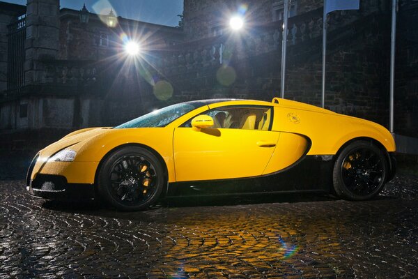 Car. Bugatti supercar on the pavement at night