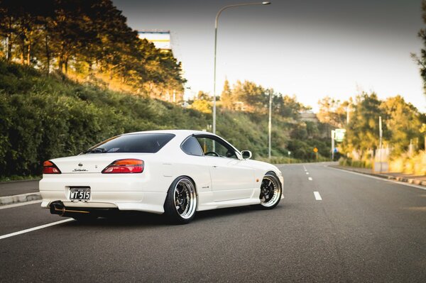 White Nissan on a sunny day