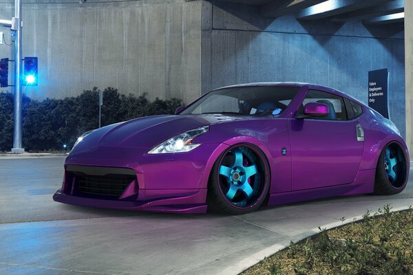 Purple sports car at the traffic light