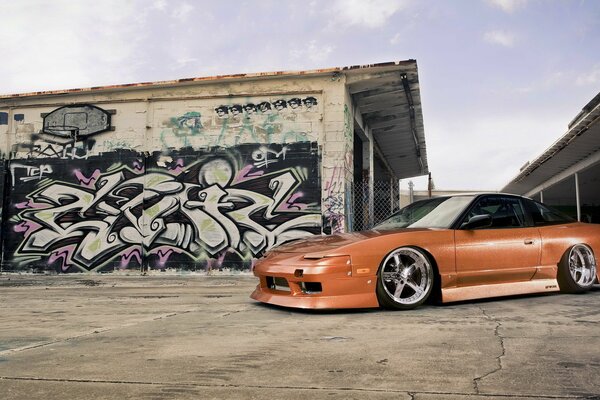 Chic wheels on an orange Nissan