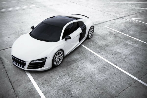 White Audi with tinted parking