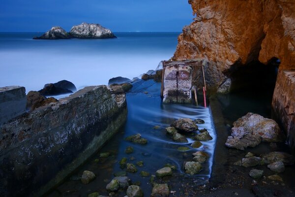 Rocks and stones in blue water