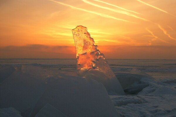 Transparent block of ice melting