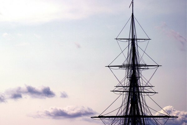 The mast of the ship somehow floats in the clouds