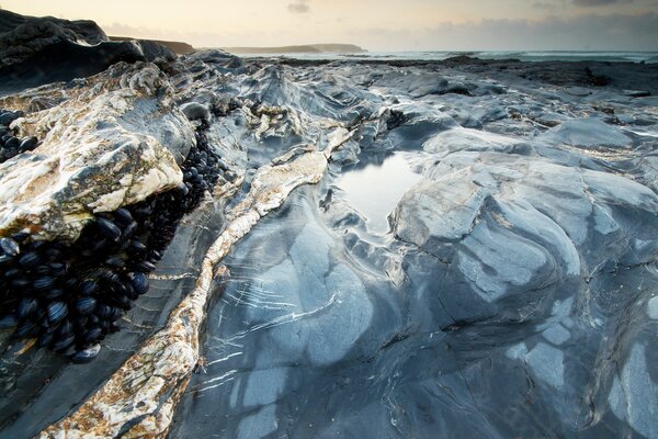 Rocky icy lake shore