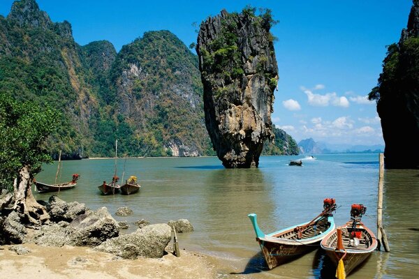 Parked boats in the ocean among the rocks