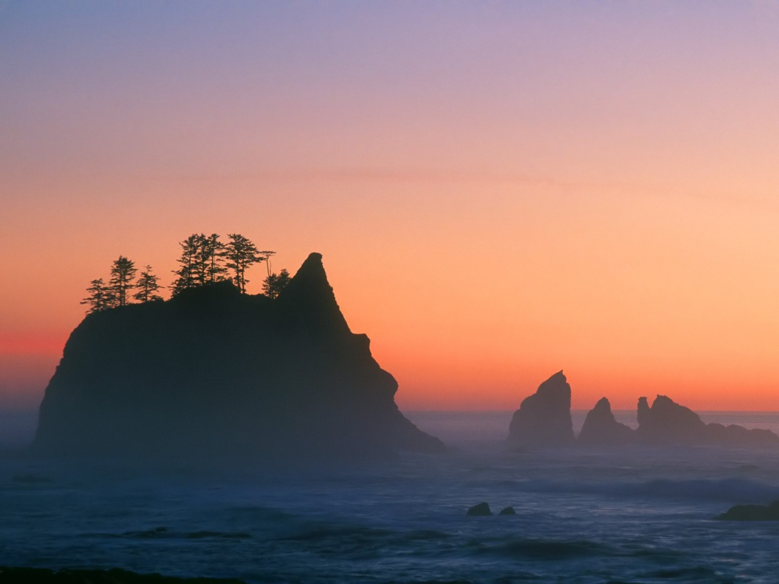 rocas mar puesta de sol árboles olas