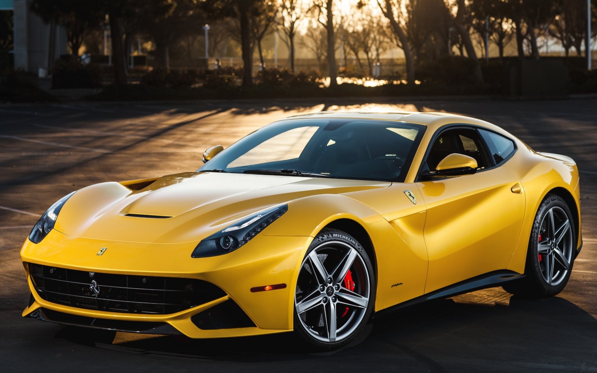 ferrari f12 berlinetta ferrari f12 berlineta supercar yellow front trees sunset background