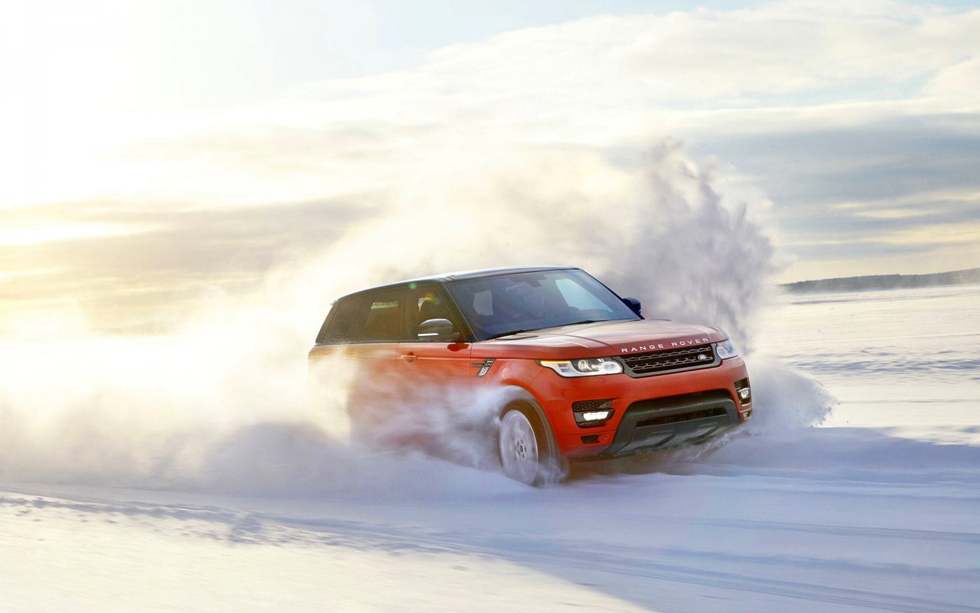 land rover range rover sport red snow winter speed in motion day sun