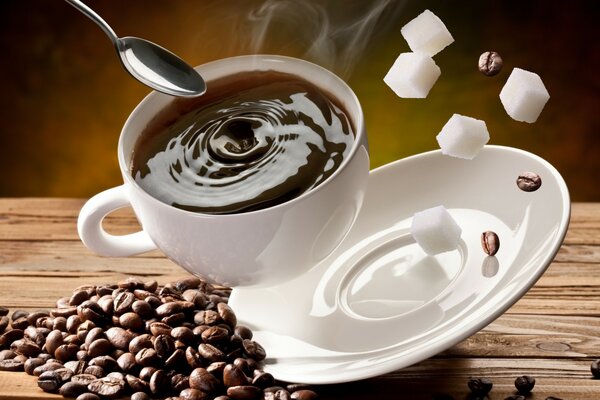 A cup of black coffee, refined and coffee beans