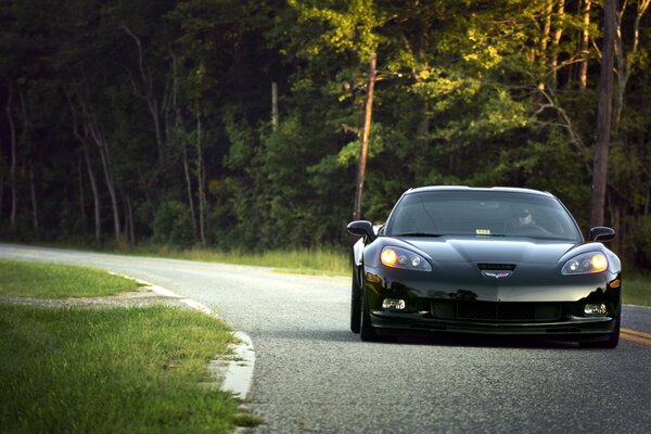 A car on a good road in the wilderness