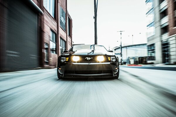 Mustang racing through the city block