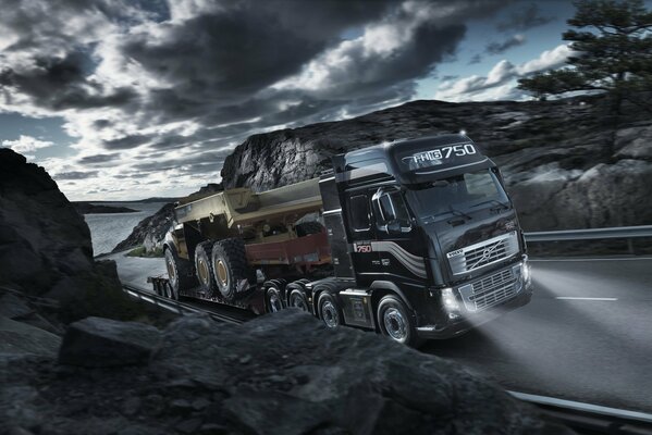 Volvo FH16 truck under gray clouds on the highway